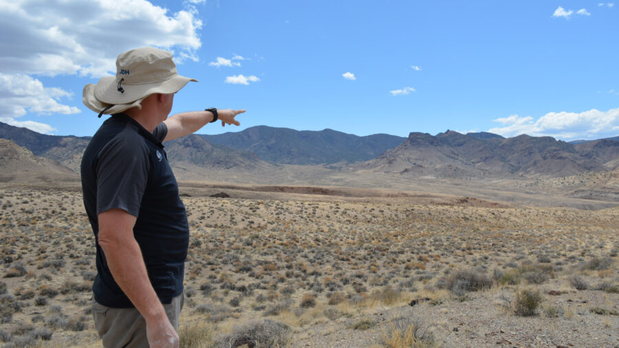 Bernard Rowe, managing director of Ioneer, points to the site of the company’s planned lithium mine on Nevada’s Rhyolite Ridge. Credit: Wyatt Myskow/Inside Climate News