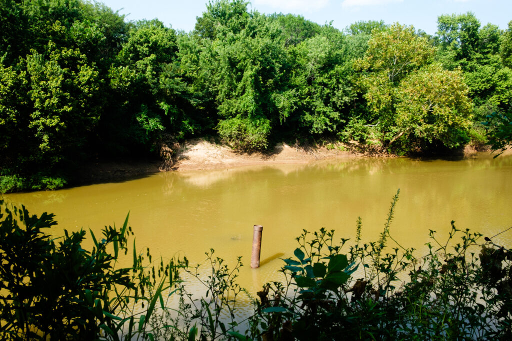 A well head is overtaken by the river in the Deep Fork National Wildlife Refuge.