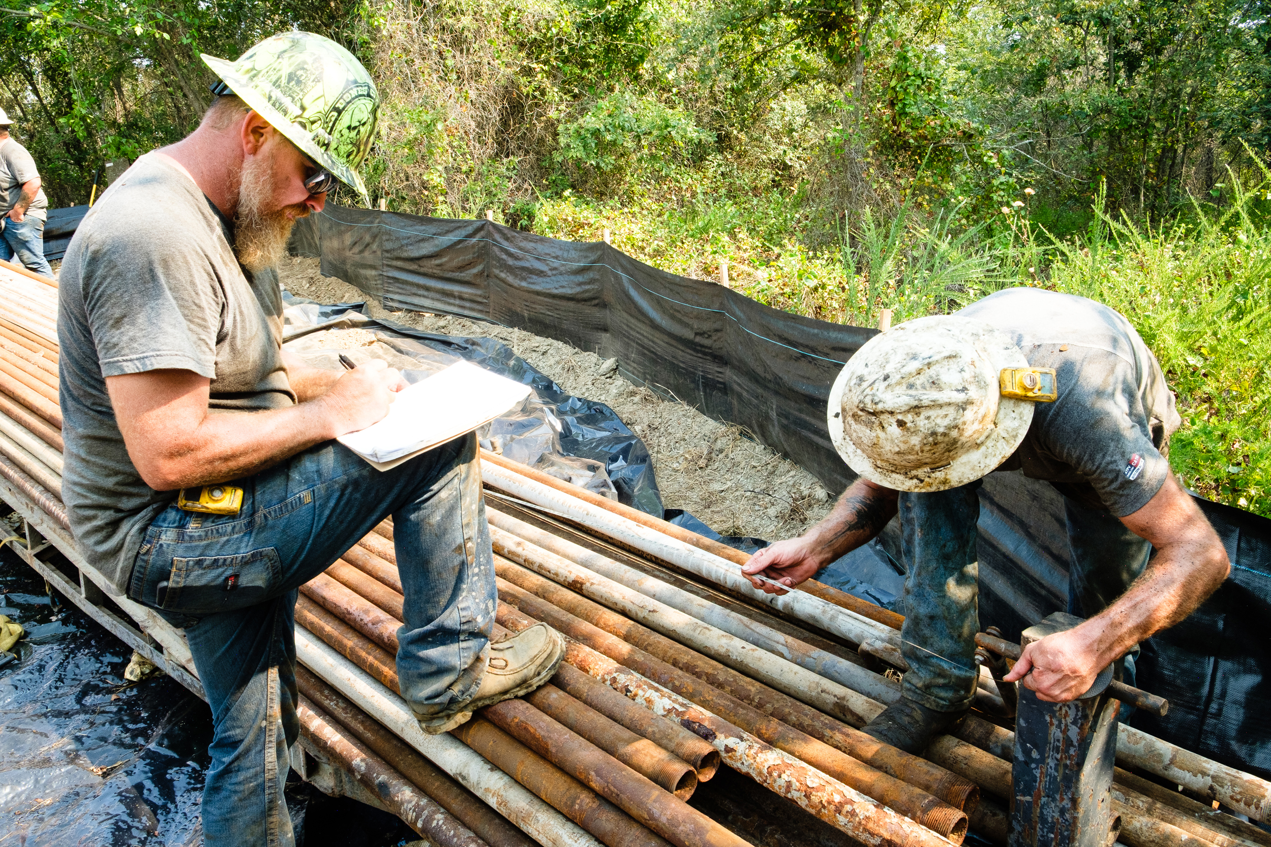 The crew logs well casing quantities and lengths.