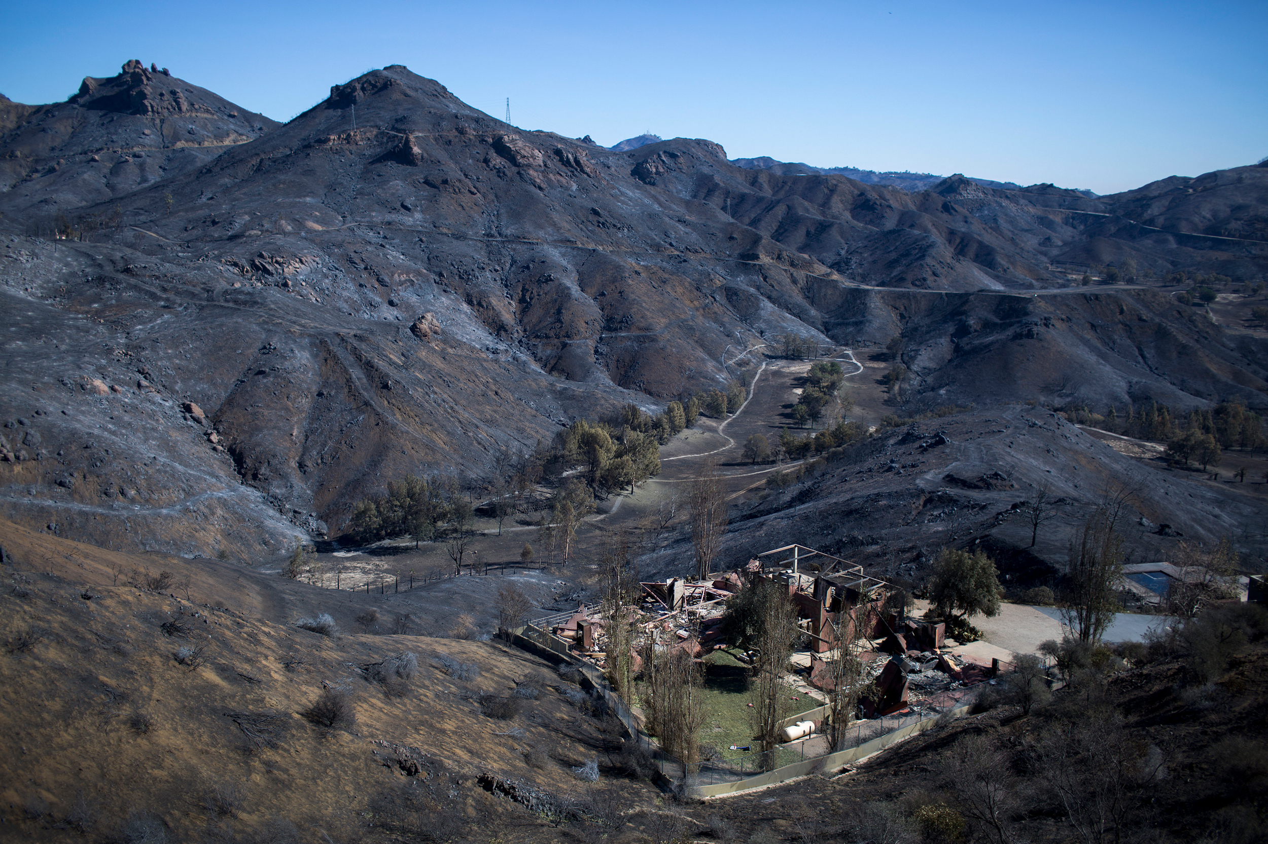 The Santa Monica Mountains are left blackened by the Woolsey Fire near Malibu, Calif., on Nov. 14, 2018. Credit: David McNew/AFP via Getty Images