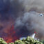 Helicopters dump water to fight a wildfire on Feb. 7, 2019, near Nelson, New Zealand. Credit: Evan Barnes/Getty Images