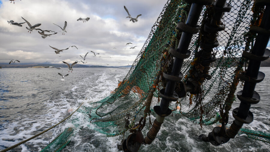 A fishing trawler drags its net through the waters near Greenock, Scotland, on March 5, 2019. Credit: Jeff J Mitchell/Getty Images