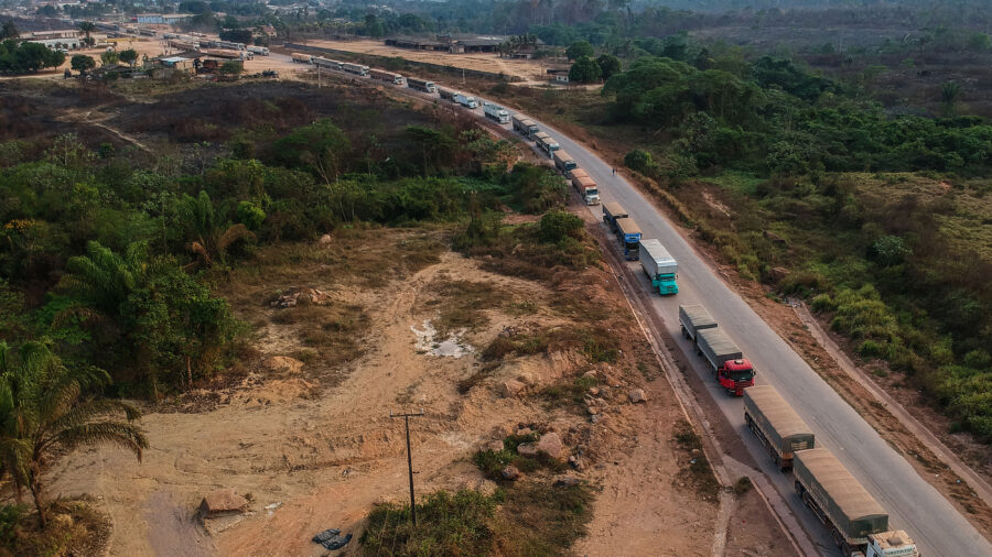 Trucks drive along the BR-163 highway through the Amazon rainforest in Pará, Brazil. Credit: Nelson Almeida/AFP via Getty Images