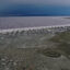 The Spiral Jetty, constructed by artist Robert Smithson in 1970, sits near the Great Salt Lake’s water on Aug. 1, 2021 in Utah. Credit: Justin Sullivan/Getty Images