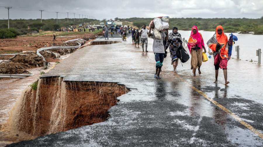 People cross a section of collapsed road during flash flooding linked to El Niño conditions on Nov. 22, 2023, near Garissa, Kenya. Credit: Luis Tato/AFP via Getty Images