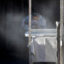 A stone countertop fabricator creates a cloud of dust while wearing a mask to help protect against airborne particles, which can contribute to silicosis, at a shop in Sun Valley, Calif. Credit: Brian van der Brug/Los Angeles Times via Getty Images
