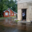 A woman sweeps floodwater out of her home on Sept. 11, 2024, in Houma, La. Credit: Brandon Bell/Getty Images