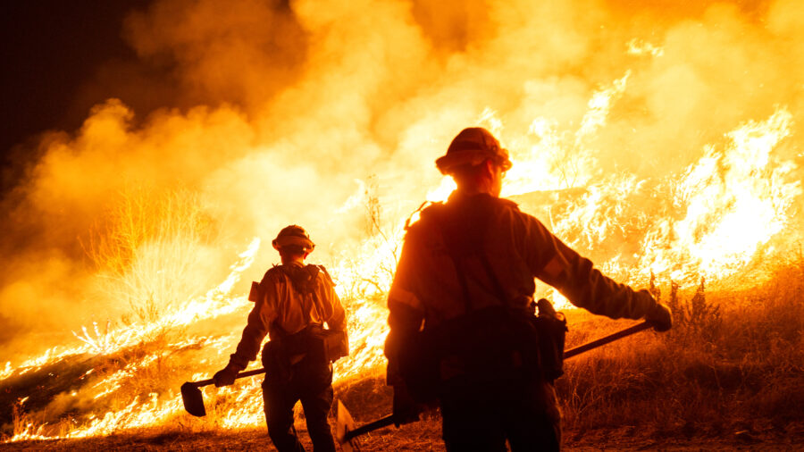 Firefighters work to contain the Hughes Fire as it burns on Jan. 22, 2025, in Castaic, Calif. Credit: Brandon Bell/Getty Images