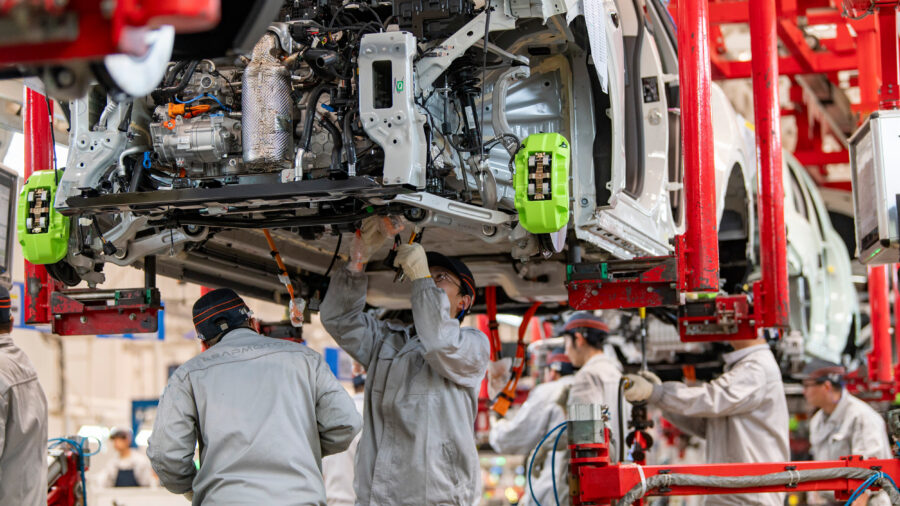Workers assemble electric vehicles on Jan. 13 at a factory in Zhejiang, China. Credit: VCG via Getty Images