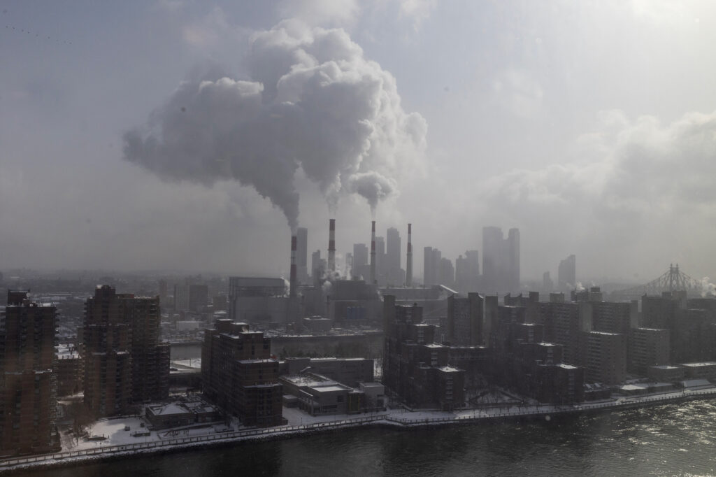Steam rises from the smoke stacks of the gas-fired Ravenswood Generating Station, New York City's largest power plant, on Jan. 26. Credit: Andrew Lichtenstein/Corbis via Getty Images