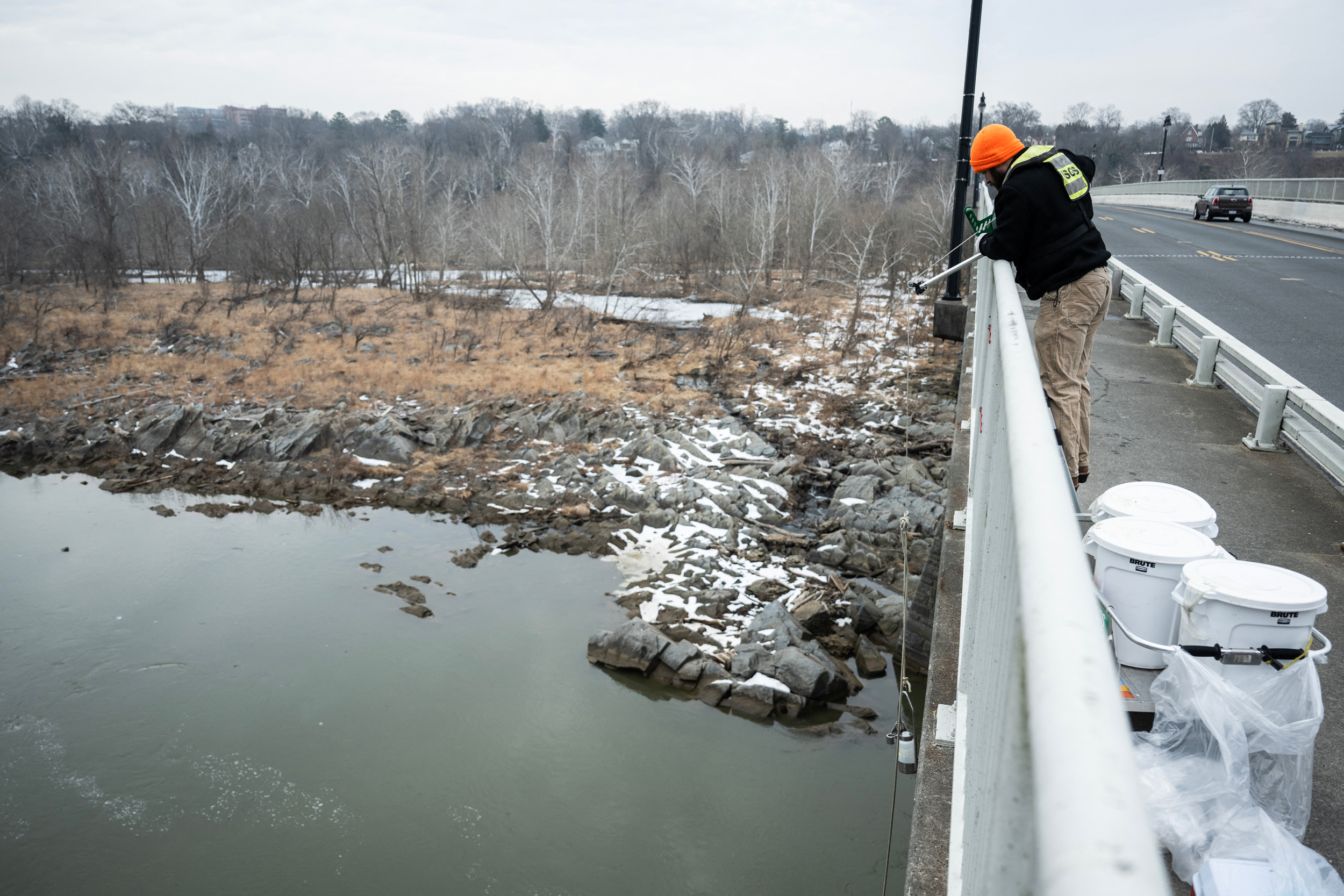A U.S. Geological Survey employee collects water samples from the Potomac River in McLean, Va., on Feb. 18 after a sewage leak released 243 million gallons of wastewater into the river. Credit: Andrew Caballero-Reynolds/AFP via Getty Images