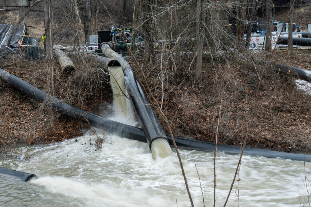 Raw sewage flows out of a drainage pipe into the C&O Canal on Feb. 18 near Cabin John, Md. Credit: Andrew Caballero-Reynolds/AFP via Getty Images
