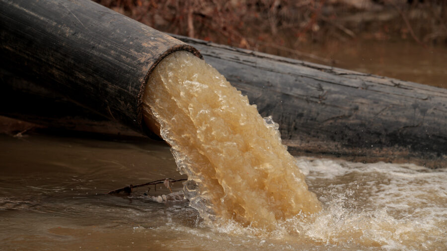 Pipes divert raw sewage into the C&O Canal around a broken section of the Potomac Interceptor on Feb. 16 in Cabin John, Md. Credit: Chip Somodevilla/Getty Images
