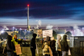 Steam rises from a JBS beef production facility as workers strike during the early morning hours on March 16 in Greeley, Colo. Credit: Brice Tucker/MediaNews Group/Greeley Tribune via Getty Images