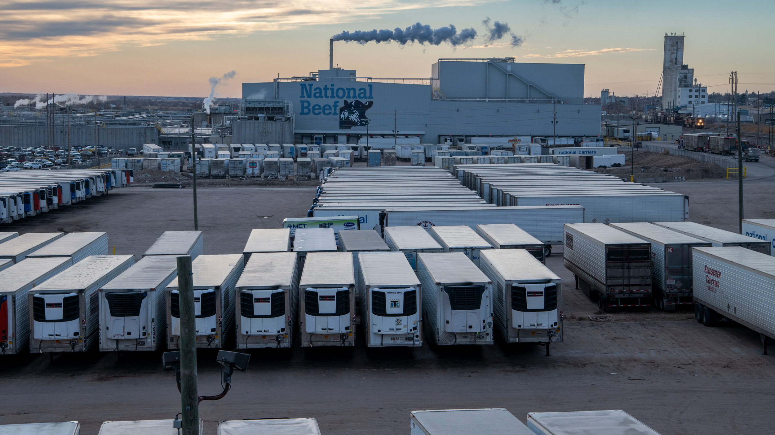 Refrigerated trailers sit in front of a National Beef processing plant in Dodge City, Kan. Credit: Michael Siluk/Universal Images Group via Getty Images