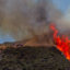 Firefighters work to combat a hotspot in the hills while the Sandy Fire continues to burn near a residential area on Wednesday in Simi Valley, Calif. Credit: Apu Gomes/AFP via Getty Images
