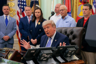 President Donald Trump is joined by grocery store owners and supermarket corporation executives as he announces regulatory rollbacks on chemical refrigerants at the White House on May 21. Credit: Chip Somodevilla/Getty Images