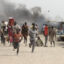 People flee a U.N. base, where gunmen opened fire on South Sudanese civilians sheltering inside, in the town of Malakal on Feb. 18, 2016. Scientists tracing links between climate impacts and conflicts found that some regions can tip toward violence when they reach extreme drought tipping points. Credit: Justin Lynch/AFP via Getty Images