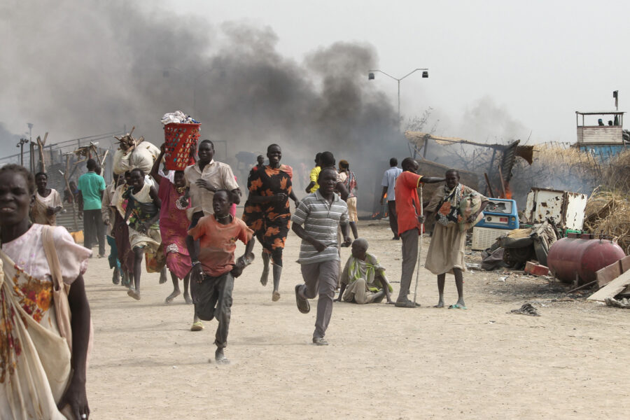 People flee a U.N. base, where gunmen opened fire on South Sudanese civilians sheltering inside, in the town of Malakal on Feb. 18, 2016. Scientists tracing links between climate impacts and conflicts found that some regions can tip toward violence when they reach extreme drought tipping points. Credit: Justin Lynch/AFP via Getty Images