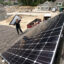 Solar panels are installed on the roof of a home at a housing development in Falmouth, Maine. Credit: Ben McCanna/Portland Portland Press Herald via Getty Images