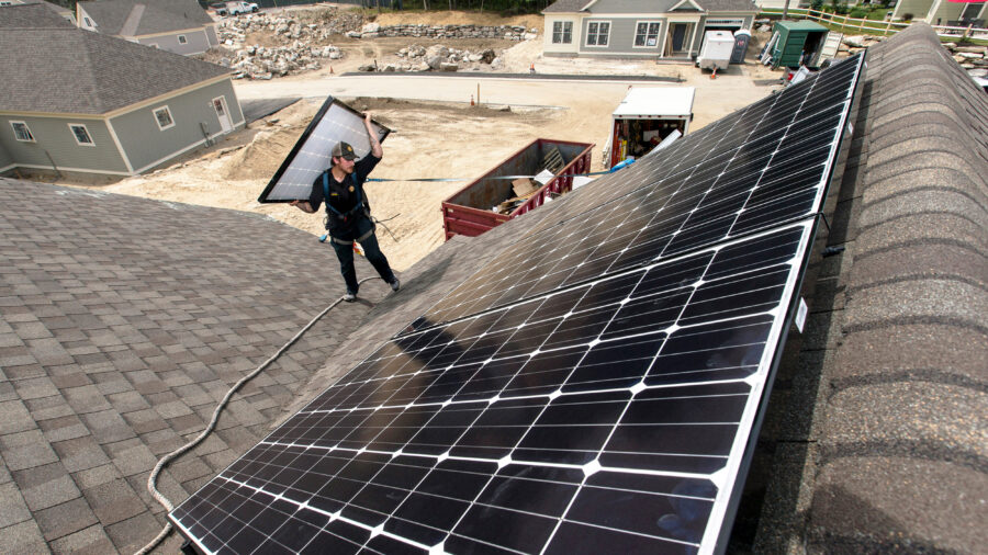 Solar panels are installed on the roof of a home at a housing development in Falmouth, Maine. Credit: Ben McCanna/Portland Portland Press Herald via Getty Images