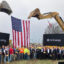Officials and local workers pose for photos following the ceremonial groundbreaking for SoftBank’s PORTS Technology Campus near Piketon, Ohio. Credit: Dan Gearino/Inside Climate News