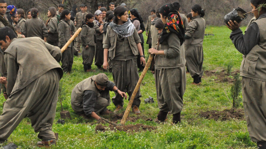 Kurdistan Workers’ Party fighters plant trees in the Qandil Mountains. Experts see an opportunity for environmental restoration after a long conflict between the group and Turkey ended last year. Credit: Kurdishstruggle/CC BY 2.0