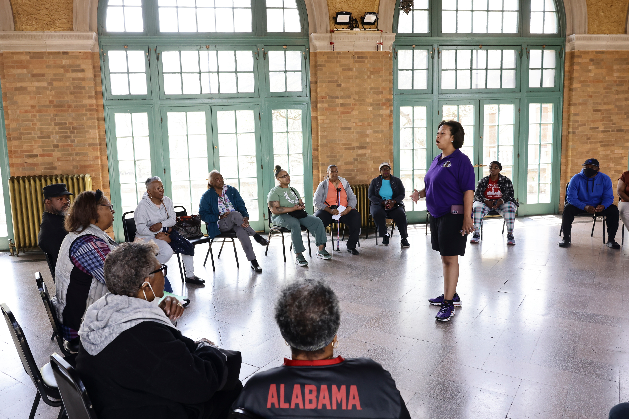 Princess Shaw speaks with homeowners at a meeting about the ongoing mold and damage complaints at the Columbus Park Refectory at 5701 W Jackson Blvd in Austin. Homeowners are still dealing with the damage from the 2023 flooding. Credit: Anthony Vazquez/Sun-Times
