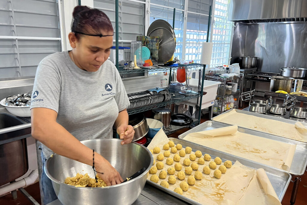 Migdalia Mass Llorens in the kitchen at La Cancha Sana, preparing vegetarian “meatballs” made from chickpeas for Amo mis Abus on Dec. 5, 2025.