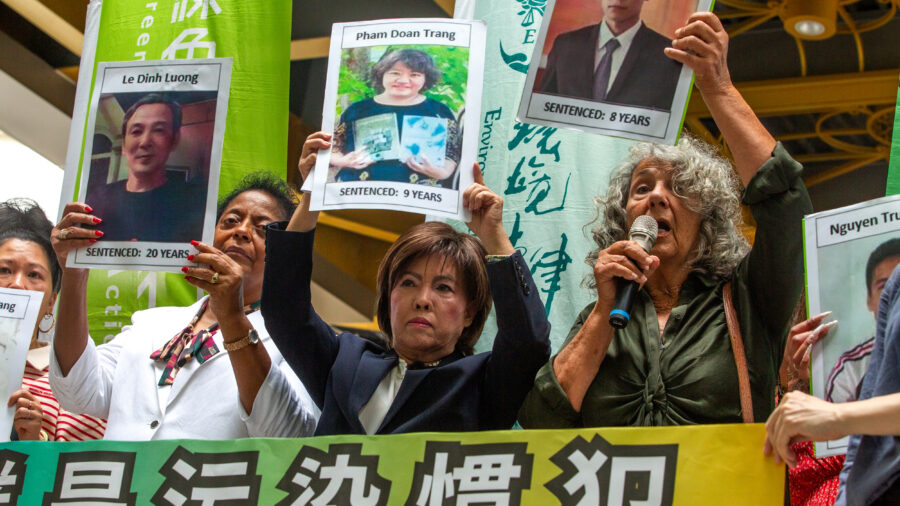 Diane Wilson (right), Sharon Lavigne (left) and Nancy Bui display pictures of Vietnamese activists jailed for demanding reparations over the Formosa Plastics’ 2016 chemical spill disaster on May 28 in Taipei. Credit: Dylan Baddour/Inside Climate News