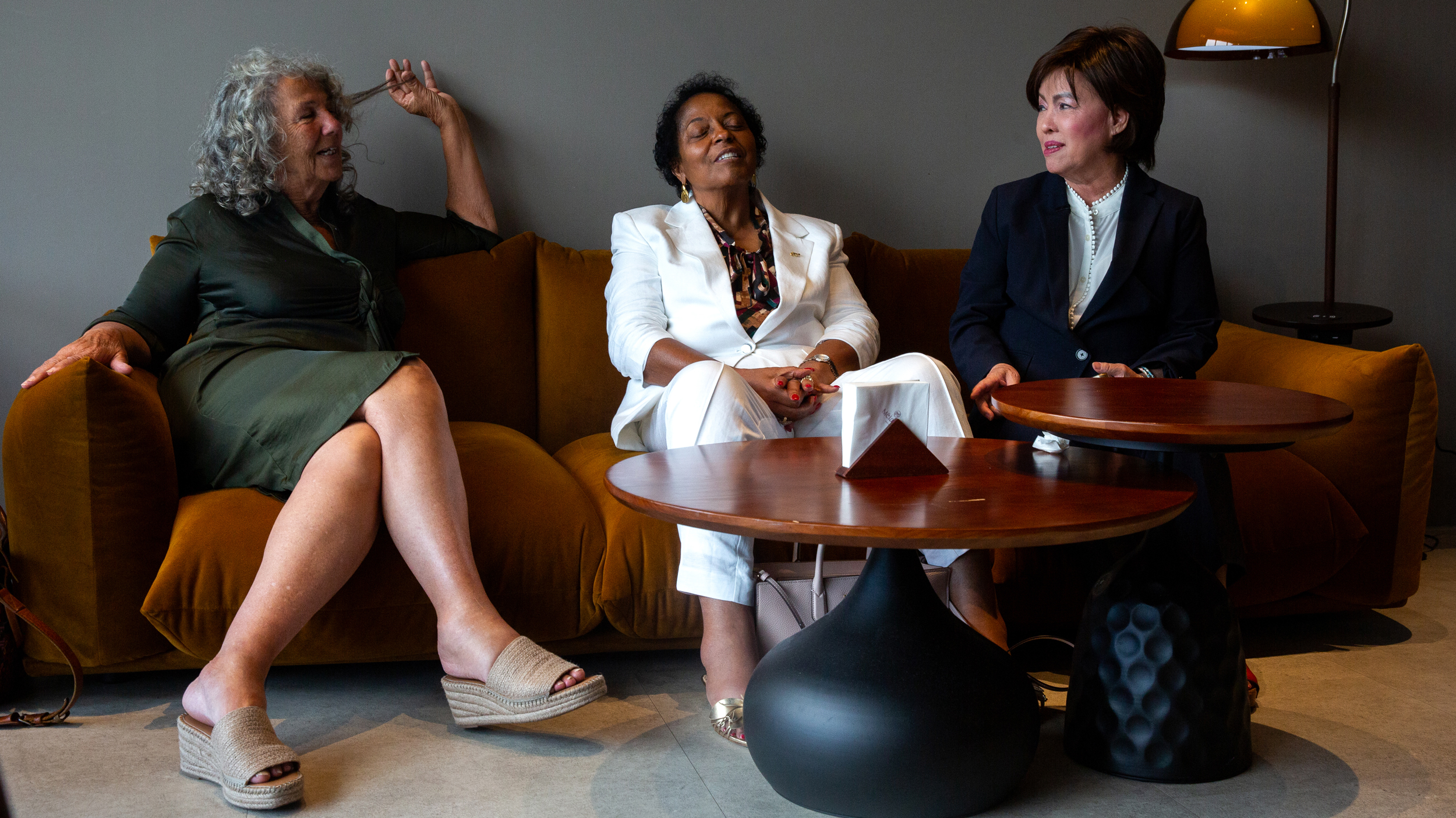 Diane Wilson, Sharon Lavigne and Nancy Bui unwind at a hotel cafe after their presentations to Formosa shareholders on May 28.