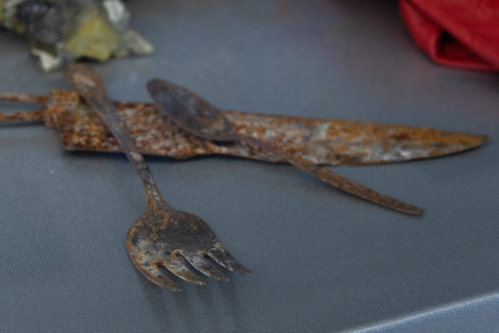 Kitchen utensils from a home burned during the 2018 Woosley Fire in California were displayed at the exhibit. Credit: Gabriel Matias Castilho/Inside Climate News