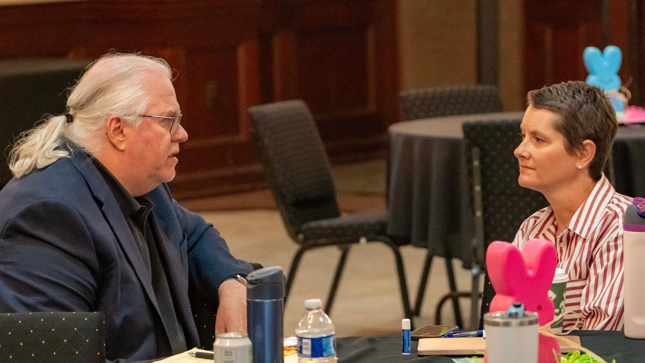 James Bruggers speaks with his colleague Amy Green at an ICN staff retreat in Birmingham, Ala., in 2025. Credit: Lee Hedgepeth/Inside Climate News