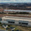 A Microsoft data center is seen under construction behind a recently constructed Amazon data center in Aldie, Va., on Jan. 20, 2023. Credit: Jahi Chikwendiu/The Washington Post via Getty Images