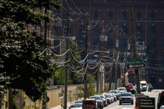 Power lines run along a neighborhood in Philadelphia. Credit: Matthew Hatcher/AFP via Getty Images