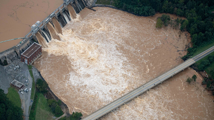 Muddy flood waters of the Catawba River pour over the Oxford Dam, threatening a highway bridge in the aftermath of Hurricane Helene on Sept. 28, 2024, in Hickory, N.C. Credit: Steve Exum/Getty Images