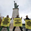 French Greenpeace activists rally to support the environmental group in Energy Transfer’s lawsuit next to the Statue of Liberty at Pont de Grenelle in Paris on Feb. 20, 2025. Credit: Thibaud Moritz/AFP via Getty Images