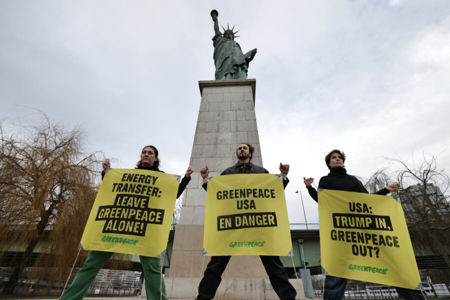 French Greenpeace activists rally to support the environmental group in Energy Transfer’s lawsuit next to the Statue of Liberty at Pont de Grenelle in Paris on Feb. 20, 2025. Credit: Thibaud Moritz/AFP via Getty Images