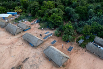 Solar panels sit next to homes in the village of Metuktire in the Amazon rainforest of Brazil on March 22, 2025. Credit: Pablo Porciuncula/AFP via Getty Images