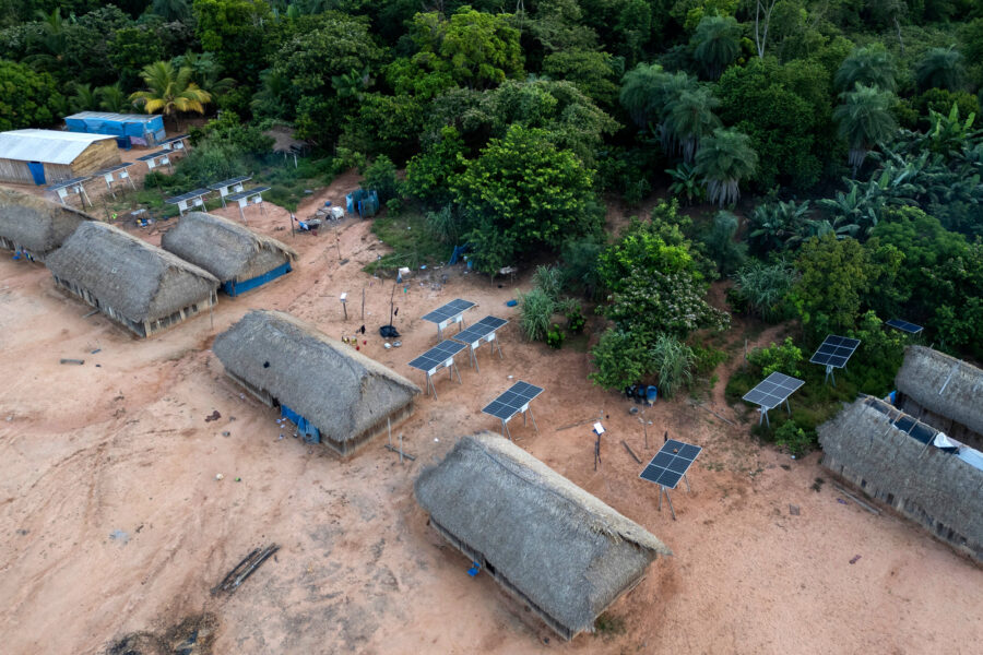 Solar panels sit next to homes in the village of Metuktire in the Amazon rainforest of Brazil on March 22, 2025. Credit: Pablo Porciuncula/AFP via Getty Images