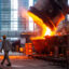 A worker walks past molten steel at a factory in Huai'an, China, on July 22, 2025. Credit: CN-STR/AFP via Getty Images