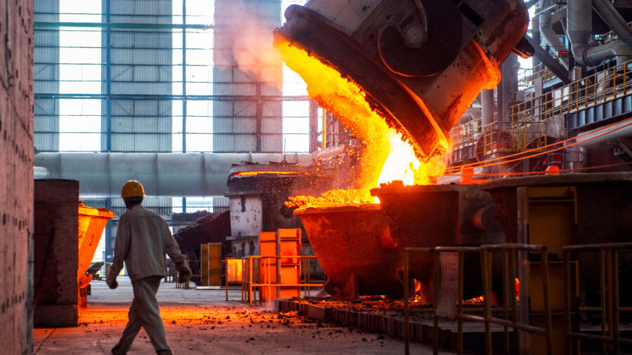 A worker walks past molten steel at a factory in Huai'an, China, on July 22, 2025. Credit: CN-STR/AFP via Getty Images