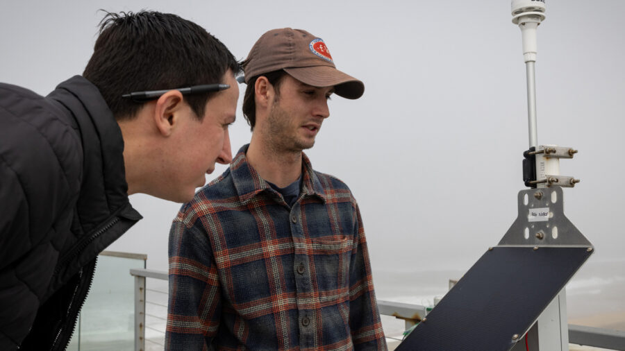 Researchers look at an air quality monitor on April 10, 2025, in Imperial Beach, Calif. Credit: Ana Ramirez/The San Diego Union-Tribune via Getty Images