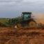 A tractor berms soil for almond trees on a farm near Lodi, Calif., on Oct. 13, 2025. Credit: Patrick T. Fallon/AFP via Getty Images