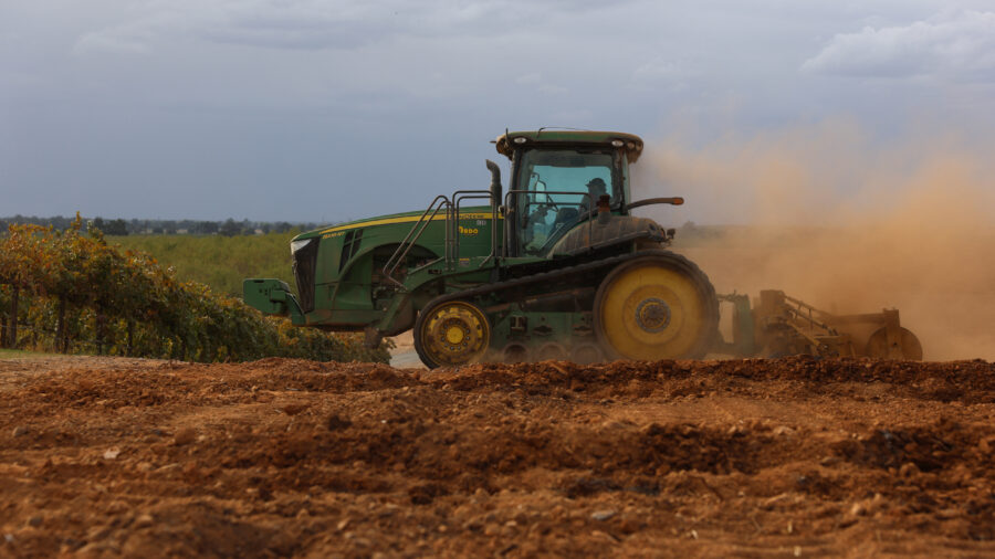 A tractor berms soil for almond trees on a farm near Lodi, Calif., on Oct. 13, 2025. Credit: Patrick T. Fallon/AFP via Getty Images