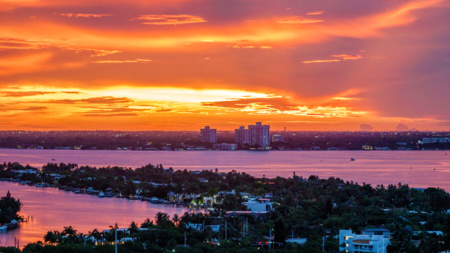 An aerial view over Miami’s Biscayne Bay at sunset. Credit: Jeffrey Greenberg/Universal Images Group via Getty Images