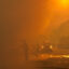 Firefighters are barely visible as smoke from the Bain Fire fills the air on May 19 in Jurupa Valley, Calif. Credit: Gina Ferazzia/Los Angeles Times via Getty Images