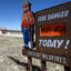The sign with Smokey Bear says, "Fire danger very high today! Prevent wildfires"