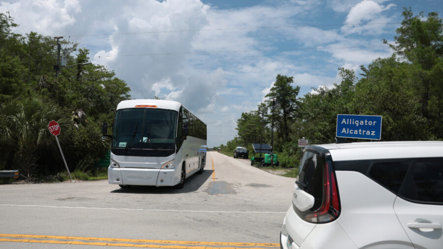 A bus pulls out from the entrance of Alligator Alcatraz in the Florida Everglades on June 1. Credit: Joe Raedle/Getty Images