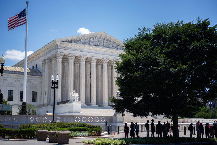 People gather in front of the Supreme Court on June 25 in Washington, D.C. Credit: Tom Williams/CQ-Roll Call, Inc via Getty Images